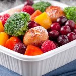 Close-up of mushy thawed vegetables showing texture loss from improper freezing.