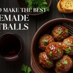 Top-down view of a bowl of homemade Italian meatballs with parsley garnish on a wooden table.